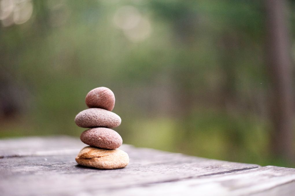 Photo of stones balanced on each other as a symbol of meditation