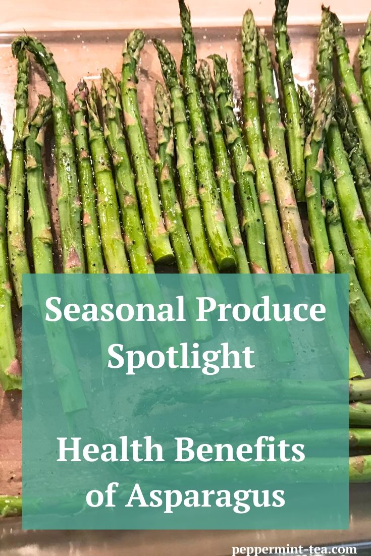 Photo of roasted asparagus laying in a dish as an example of the health benefits of asparagus