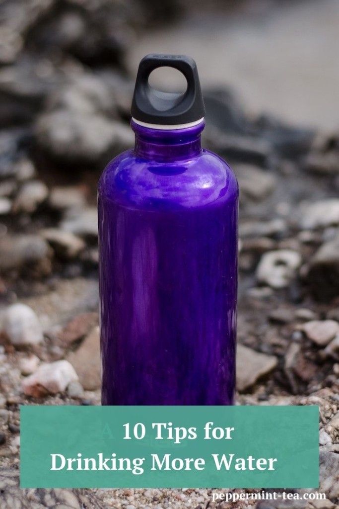 Photo of purple water bottle as an example of tips for drinking more water